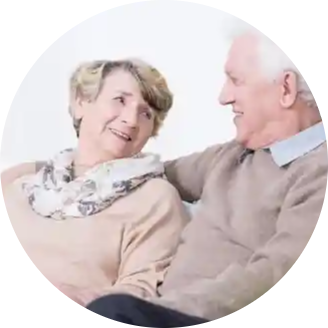 Senior couple happily sitting together