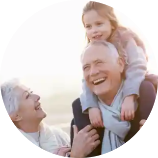 Happy senior couple with child on his shoulders